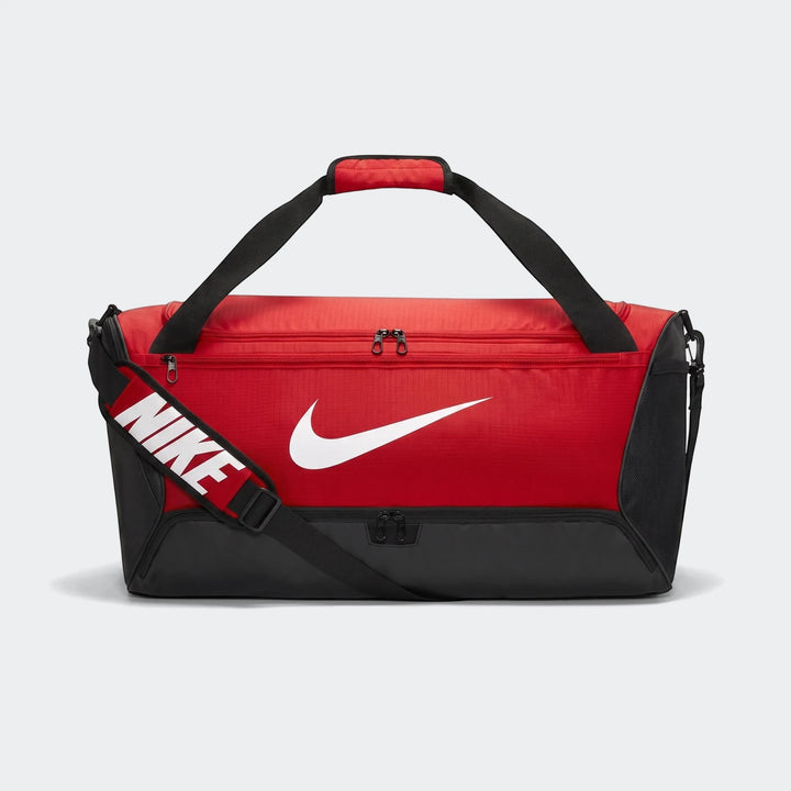 NK Brasilia Medium Duffle 60L red and black duffel bag with top handles and adjustable shoulder strap, front view.
