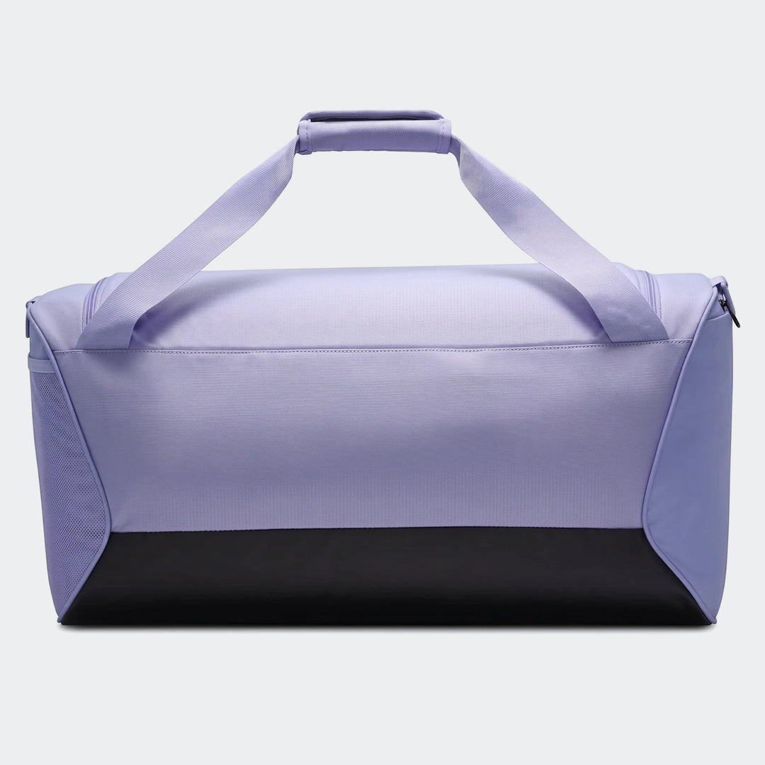 Purple and black Nk Brsla M Duff 9.5 duffel bag, side view, for sports or travel.