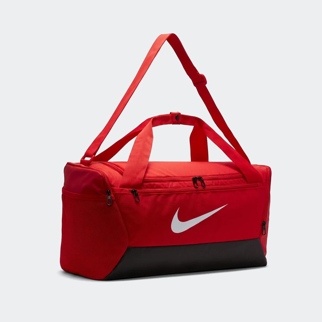 Nk Brsla S Duff 9.5 red duffel bag with zip main compartment, shoulder strap, and black reinforced base.