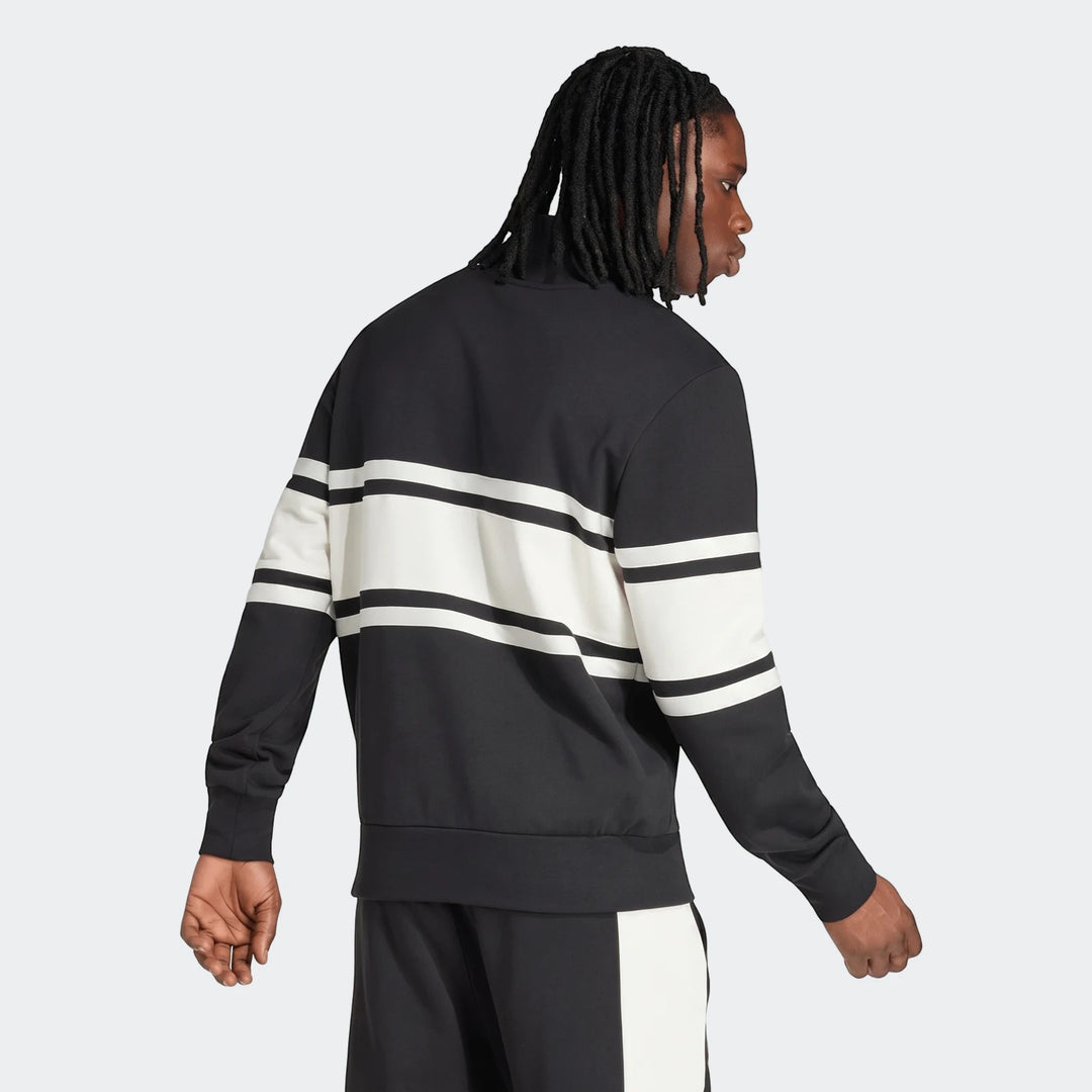 Male model from behind wearing a New Zealand Rugby Leisurewear Quarter Zip Sweatshirt in black with white stripes. His back