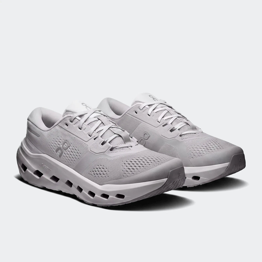 A pair of light grey On Running Cloudrunner 3 Glacier sneakers, showcasing their design and sole technology from an angled