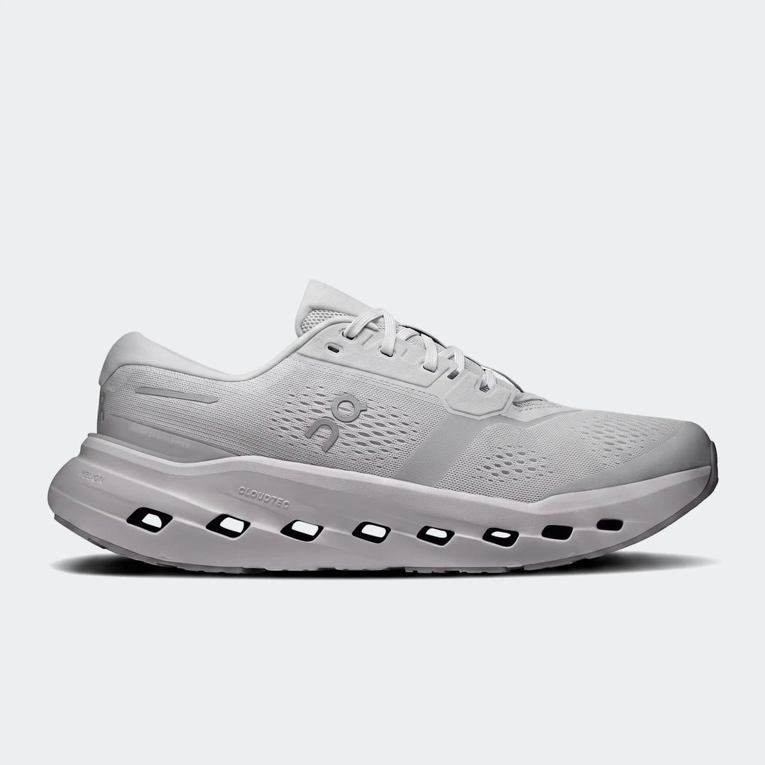 Side view of an On Running Cloudrunner 3 Glacier running sneaker, featuring a light gray mesh upper, white laces, and a