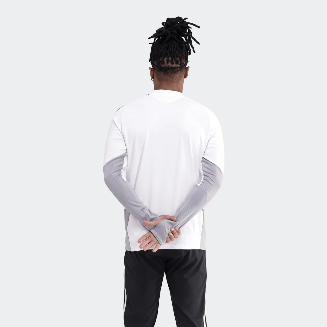 Op Tiro26C Top in white and grey, worn by a person from the back with hands clasped, paired with black track pants.