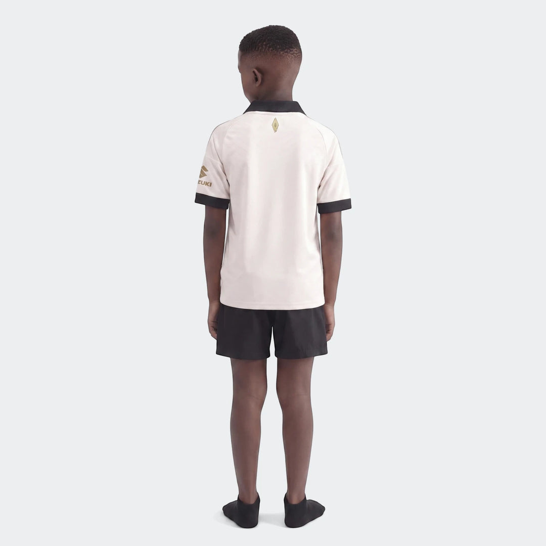 Orlando Pirates 26/27 Away Jersey for kids, modeled from the back, featuring a white shirt with black accents and gold