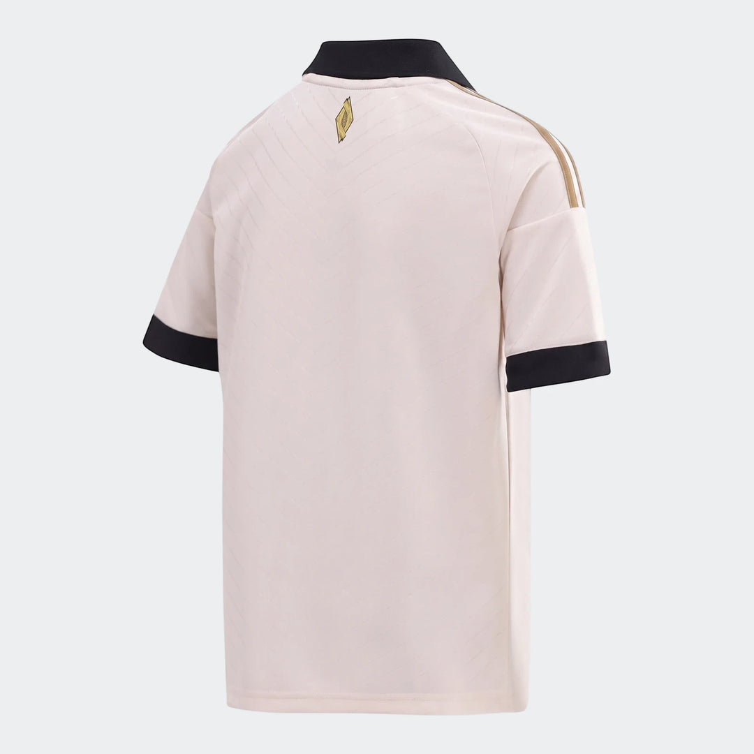 Orlando Pirates 26/27 Away Jersey Kids, featuring a light beige color with black collar and cuffs, and gold stripes, shown