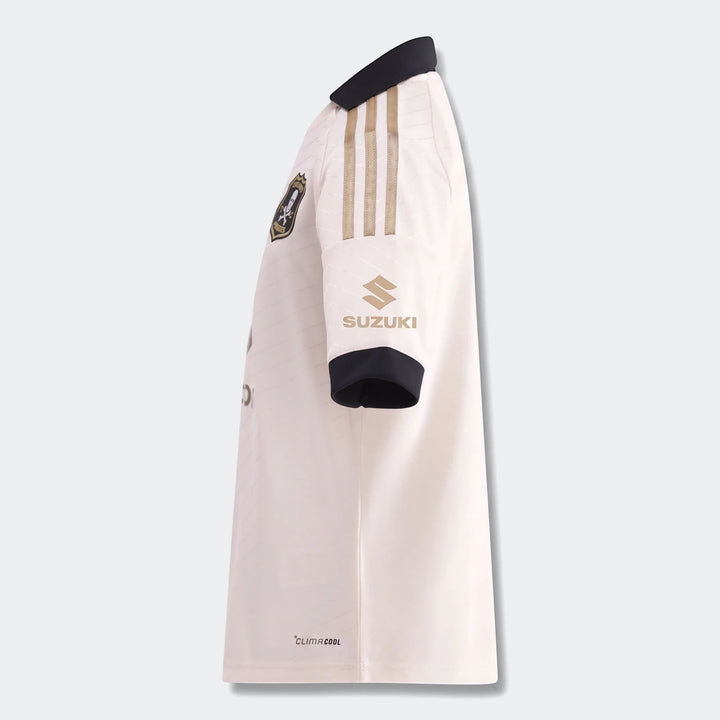 Orlando Pirates 26/27 Away Jersey for kids, featuring white fabric with gold Adidas stripes and Suzuki logo, viewed from the