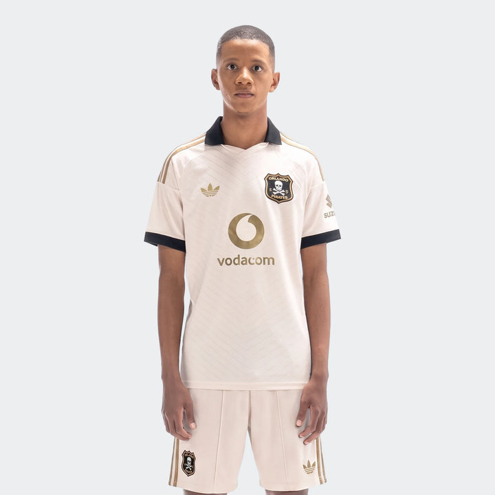 Orlando Pirates 26/27 Away Jersey for men, an off-white soccer kit with gold stripes, black collar, and club crest.