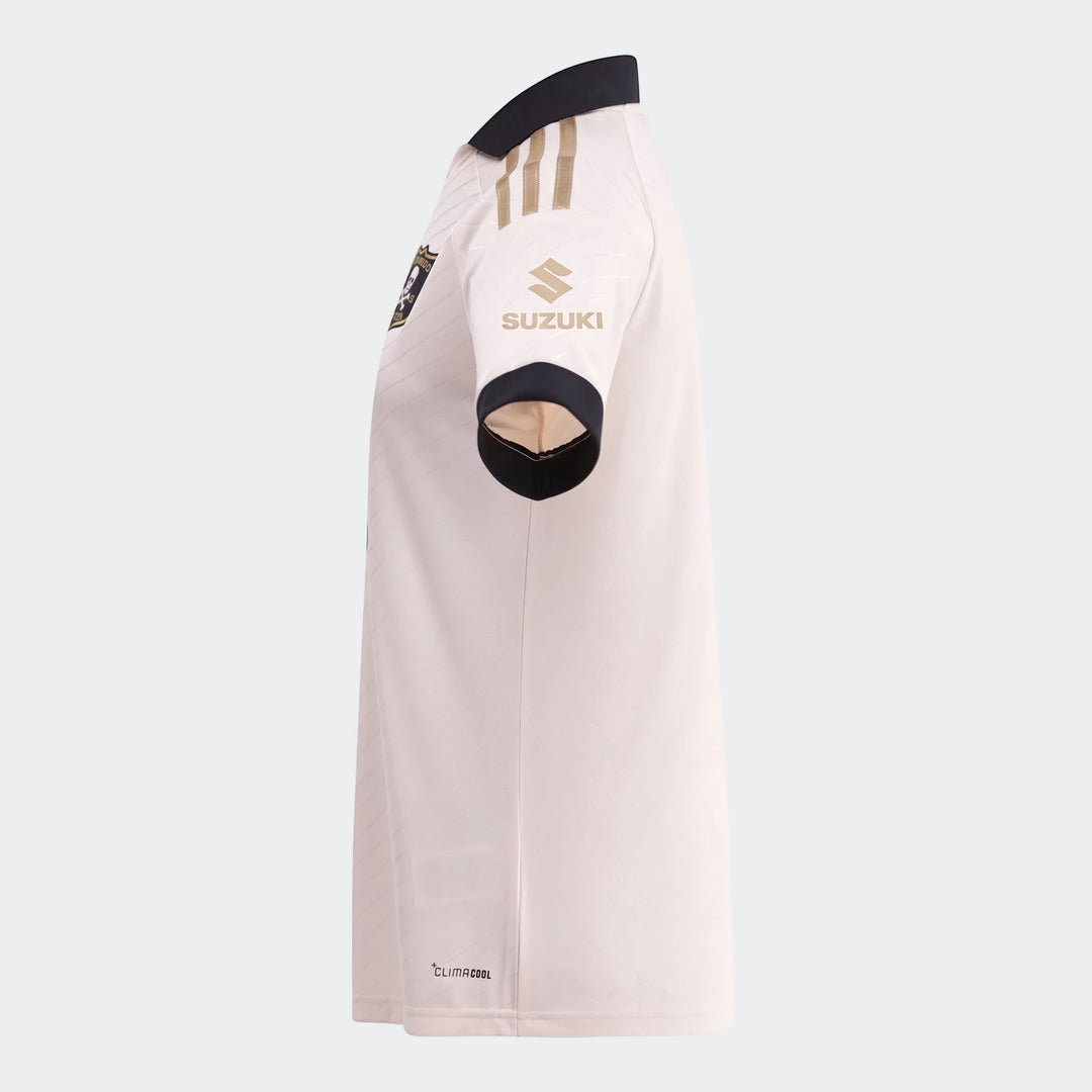 Side view of an Orlando Pirates 26/27 Away Jersey in off-white with black collar and gold Suzuki sponsor logo on sleeve.