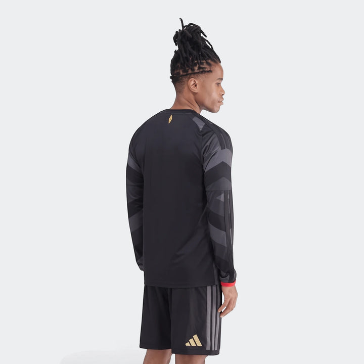 Orlando Pirates 26/27 Home Jersey, a black long-sleeve shirt worn by a man from the back.