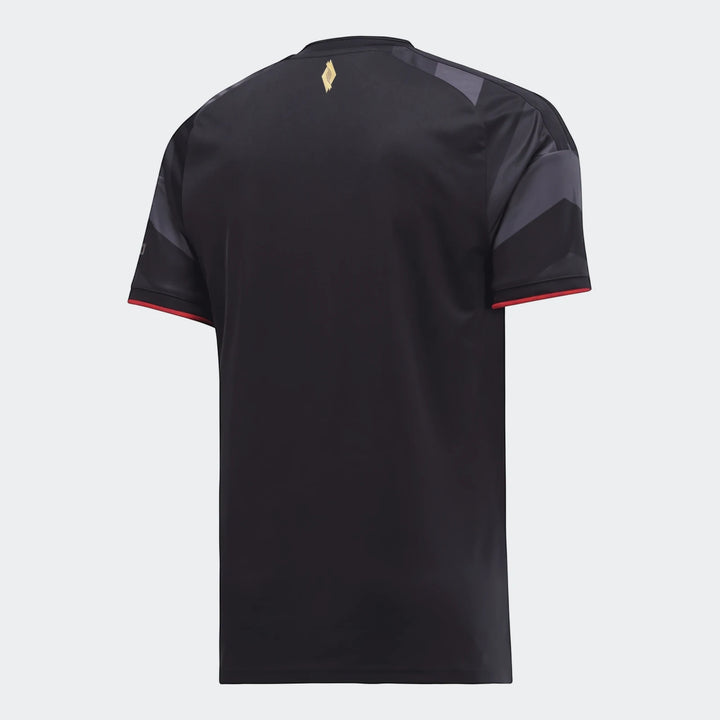 Rear view of the black Orlando Pirates 26/27 Home Jersey, featuring dark grey patterned sleeves and red cuffs, with a gold