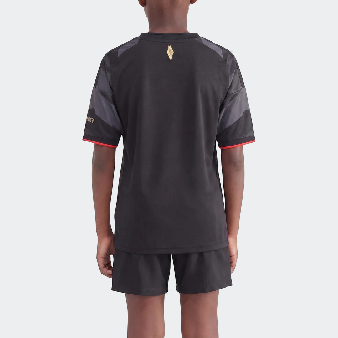 Orlando Pirates 26/27 Home Jersey for kids, black and grey with short sleeves, worn by a child model from the back.