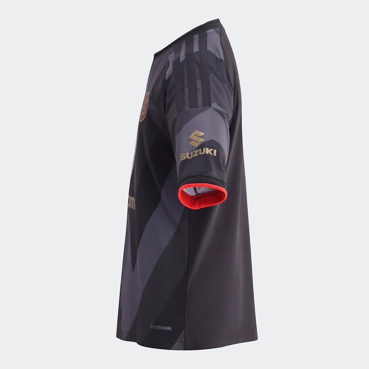 Orlando Pirates 26/27 Home Jersey for kids, black and grey, showing the right sleeve with a gold Suzuki sponsor logo.
