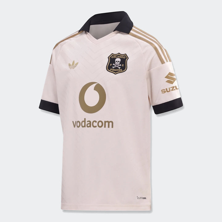 Orlando Pirates 26/27 Kids Away Jersey in cream and black with gold accents, featuring team crest and sponsor logos.