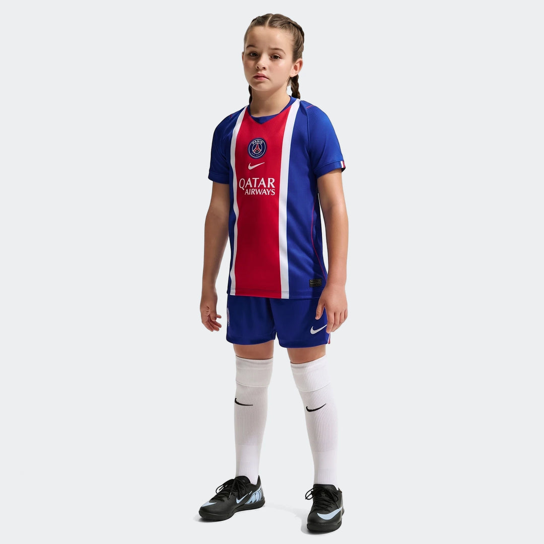 Young girl wearing the blue, red, and white Paris Saint-Germain 2026/27 Stadium Home Big Kids' Nike Dri-Fit Soccer Replica
