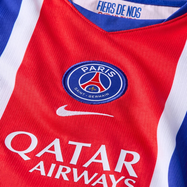 Close-up of the red Paris Saint-Germain 2026/27 Stadium Home Big Kids' Nike Dri-Fit Soccer Replica Jersey, featuring the