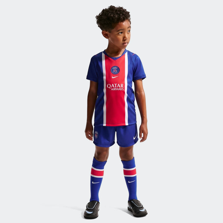 Young boy wearing a blue and red Paris Saint-Germain 2026 Stadium Home Little Kids' Nike Soccer Replica 3-Piece Kit,