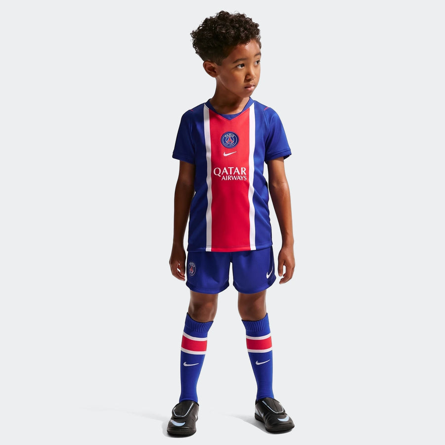 Young boy wearing a blue and red Paris Saint-Germain 2026 Stadium Home Little Kids' Nike Soccer Replica 3-Piece Kit,