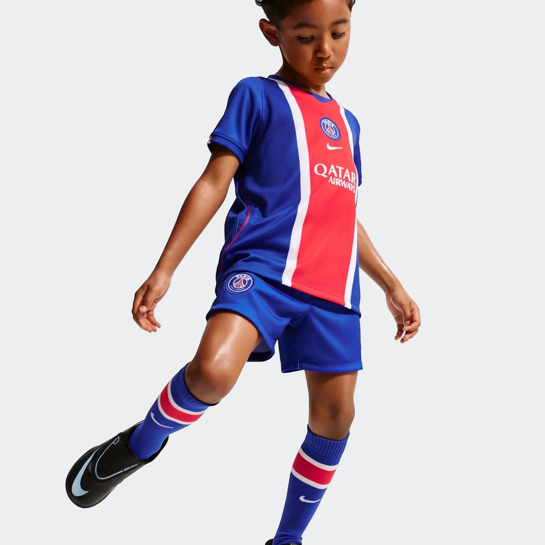 Young boy wearing the blue, red, and white Paris Saint-Germain 2026 Stadium Home Little Kids' Nike Soccer Replica 3-Piece