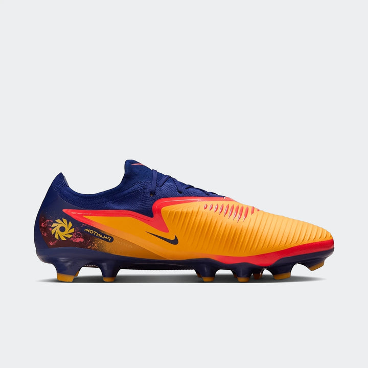 Phantom 6 Low Pro Fg Orange Boots, featuring orange and blue upper with textured detailing and multi-ground studs, viewed