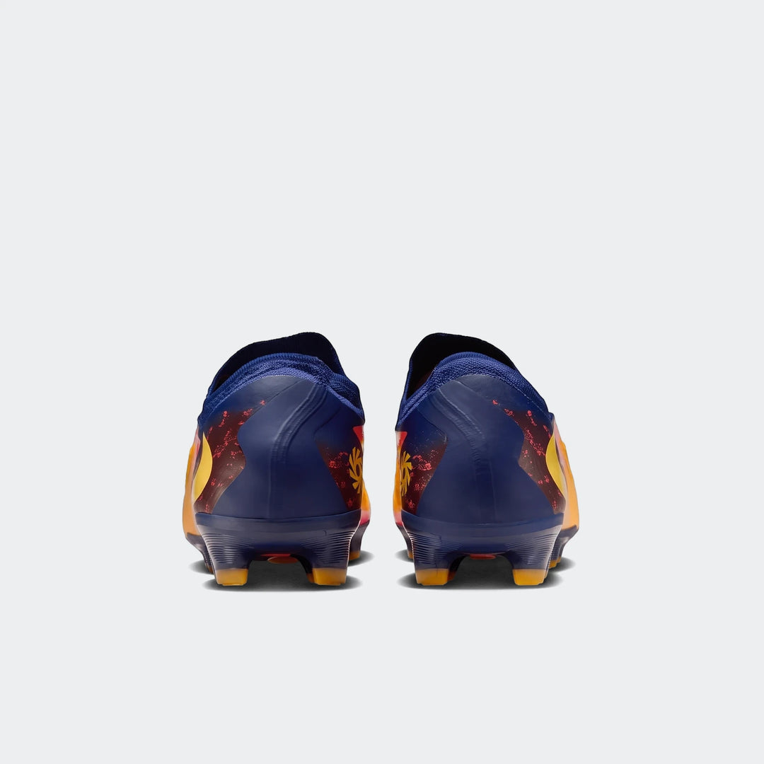 Rear view of Phantom 6 Low Pro Fg Orange Boots, featuring navy blue heels with vibrant red, orange, and yellow abstract