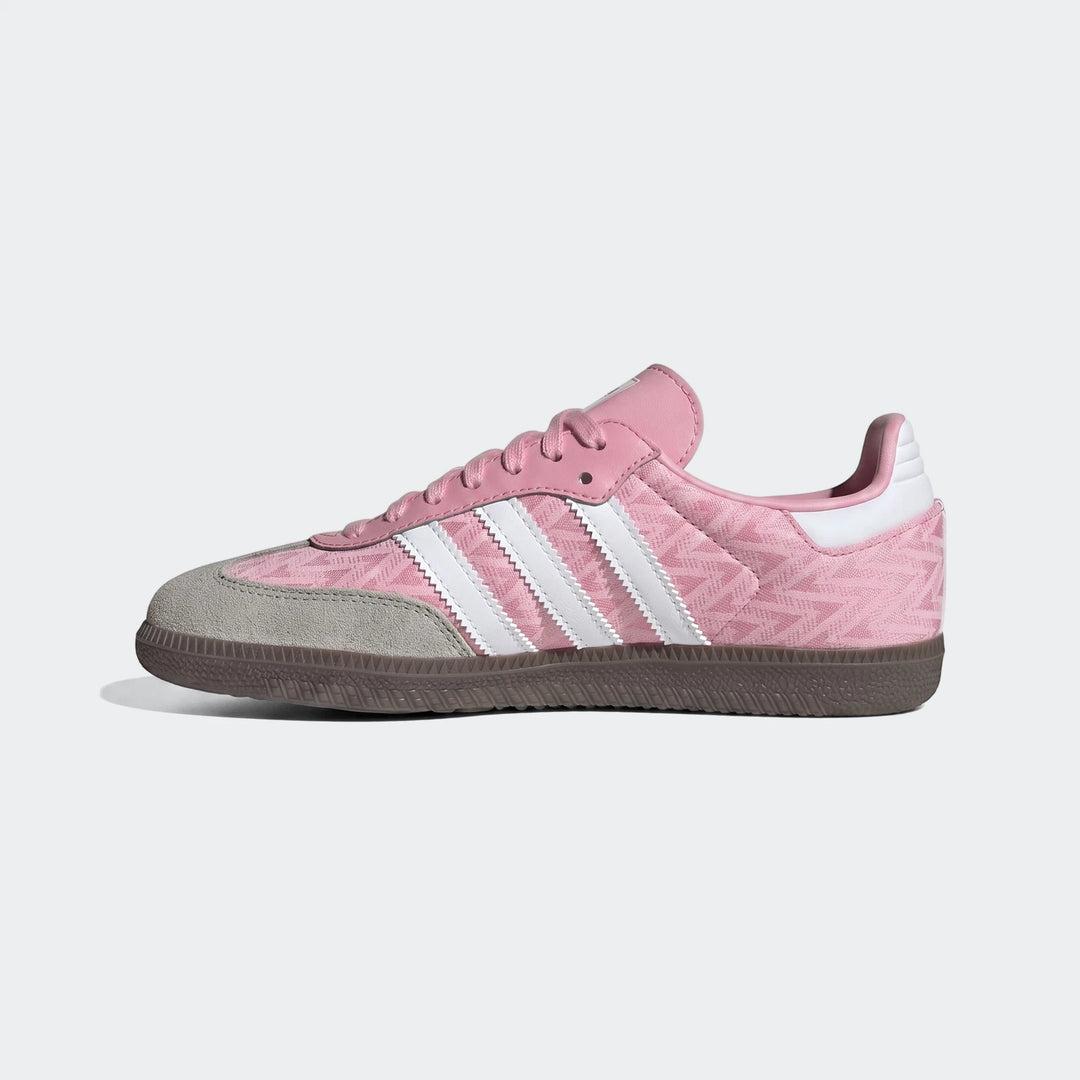 Pink Adidas Samba Og Kids Shoes with white stripes and gray suede toe, viewed from the side on a plain background.
