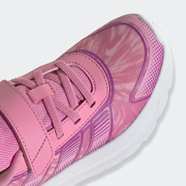 Close-up of a pink children's Adidas Tensaur Run 4.0 shoe featuring laces and a hook-and-loop strap, viewed from the