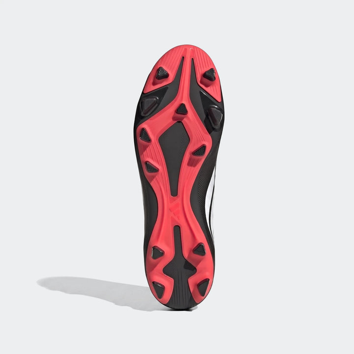 Predator Club Firm Ground Multi Ground Football Boots, black and coral/red, showing the sole with studs.