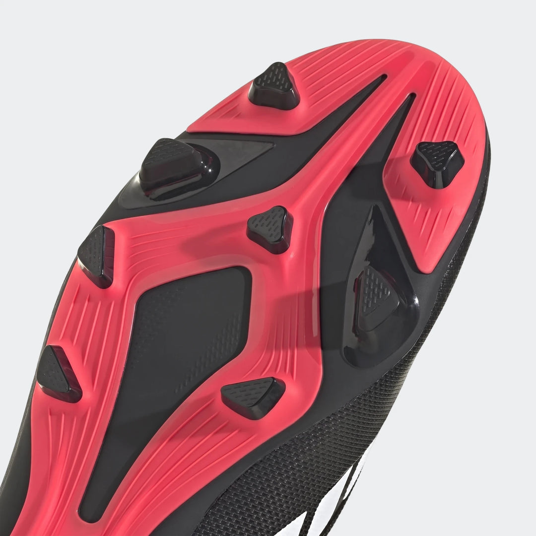 Close-up of the black and red Predator Club Firm Ground / Multi Ground Football Boots sole, featuring multi-directional