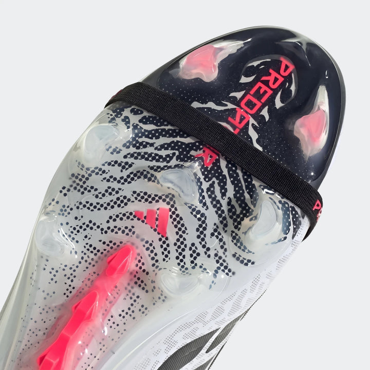 Close-up of a black, white, and pink Predator Elite Fold-Over Tongue Firm Ground Football Boot with textured, transparent