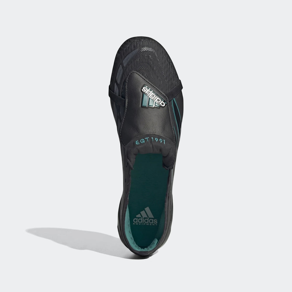 Black and teal Adidas Predator Elite Ft Fg Eqt football boots, shown from a top-down view, highlighting the design.