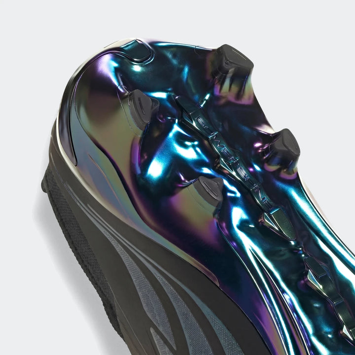 Close-up angled view of the sole of Predator Elite Ft Fg Eqt football boots, showcasing the iridescent finish and black