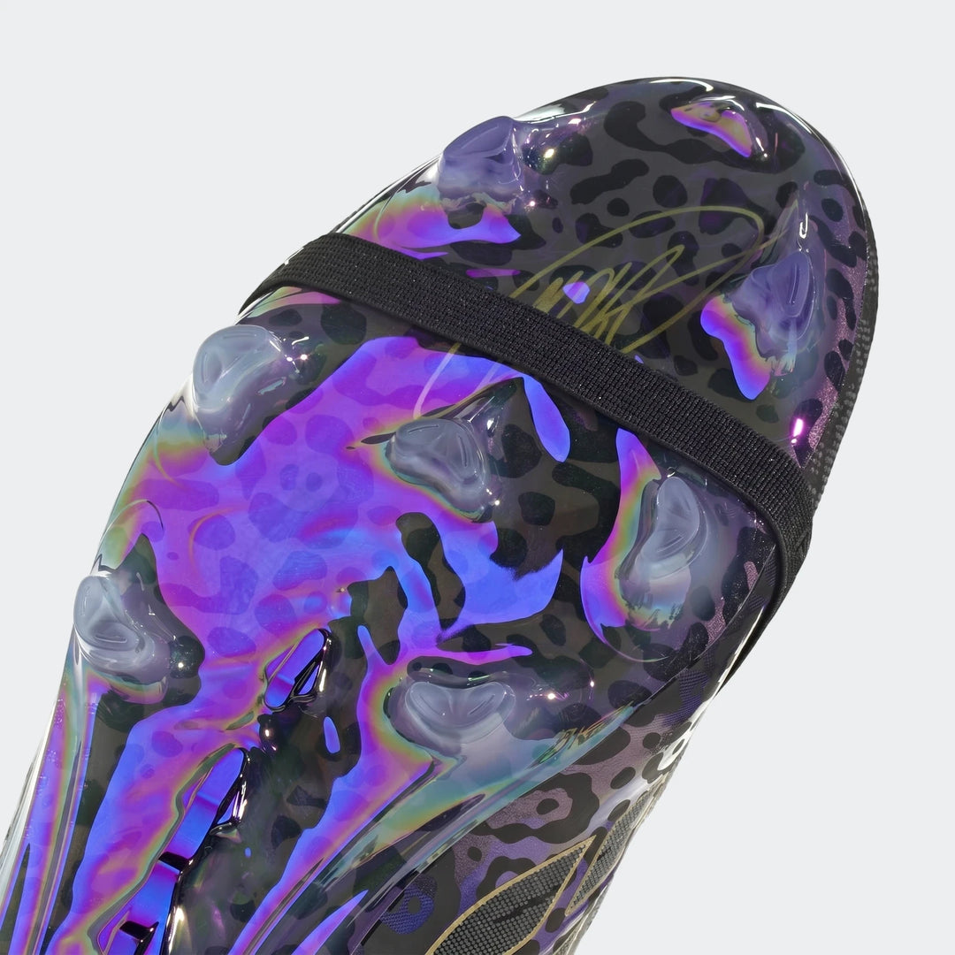 Close-up of the Predator Elite Ft Fg Kaka Edition football boots, featuring an iridescent, purple-hued leopard print design.