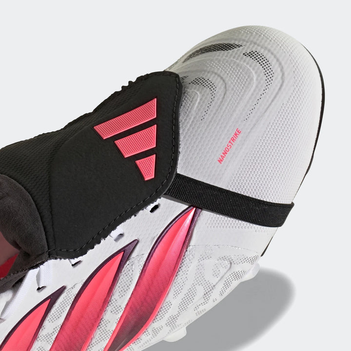 Close-up of white and pink Predator League Fold-Over Tongue Firm Ground Football Boots, showing the toe box and midfoot with