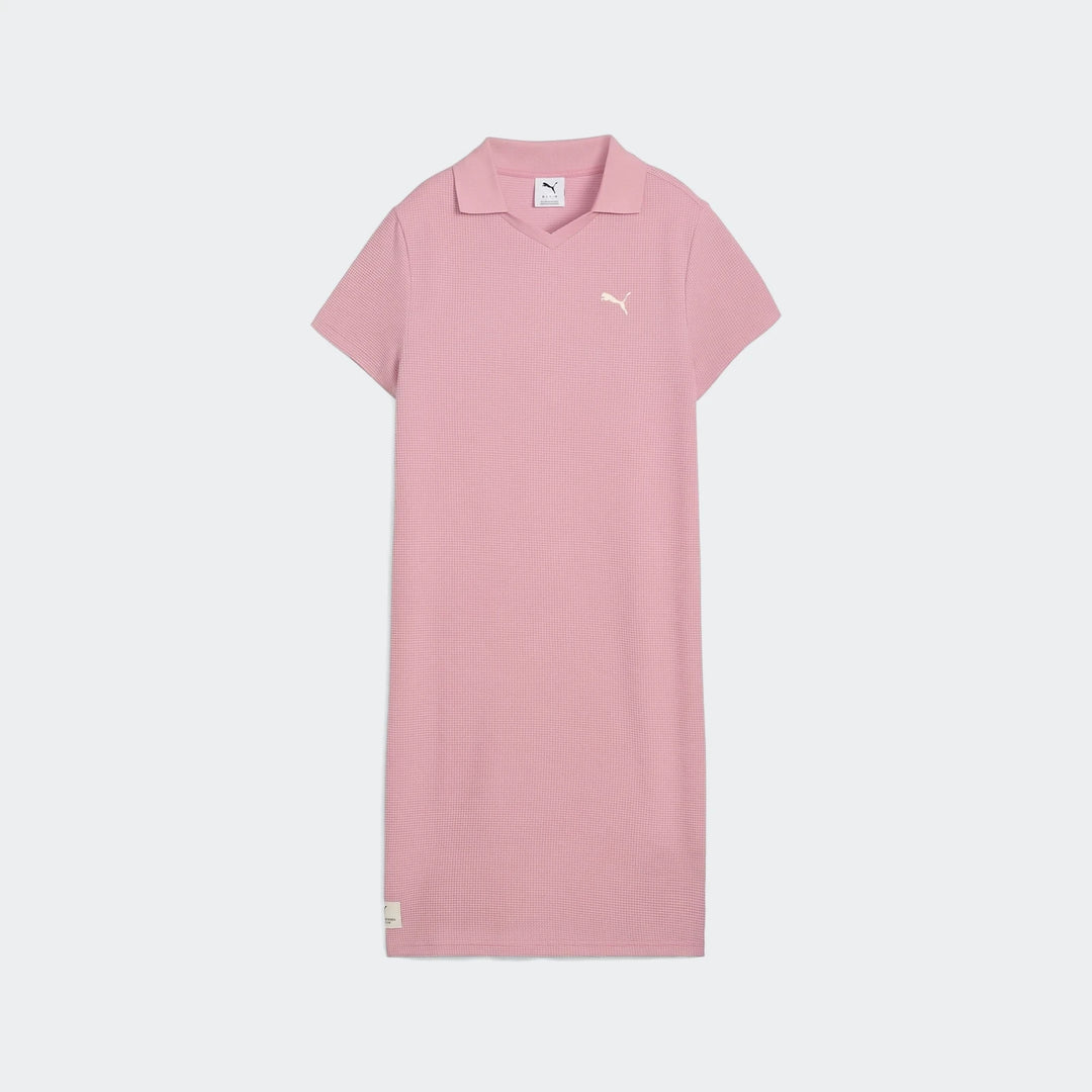 Pink Puma Class Pinnacle Dress for women, featuring a pique texture fabric, V-neck polo collar, and short sleeves, displayed