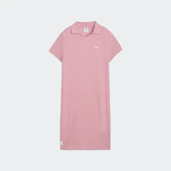 Pink Puma Class Pinnacle Dress for women, featuring a pique texture fabric, V-neck polo collar, and short sleeves, displayed