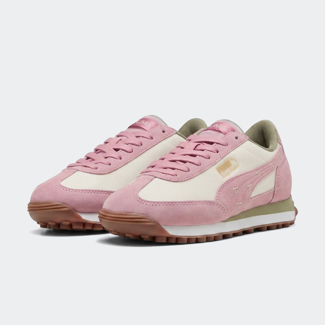Pair of Puma Easy Rider Bowtique Ps pink and off-white suede and canvas sneakers, side view.