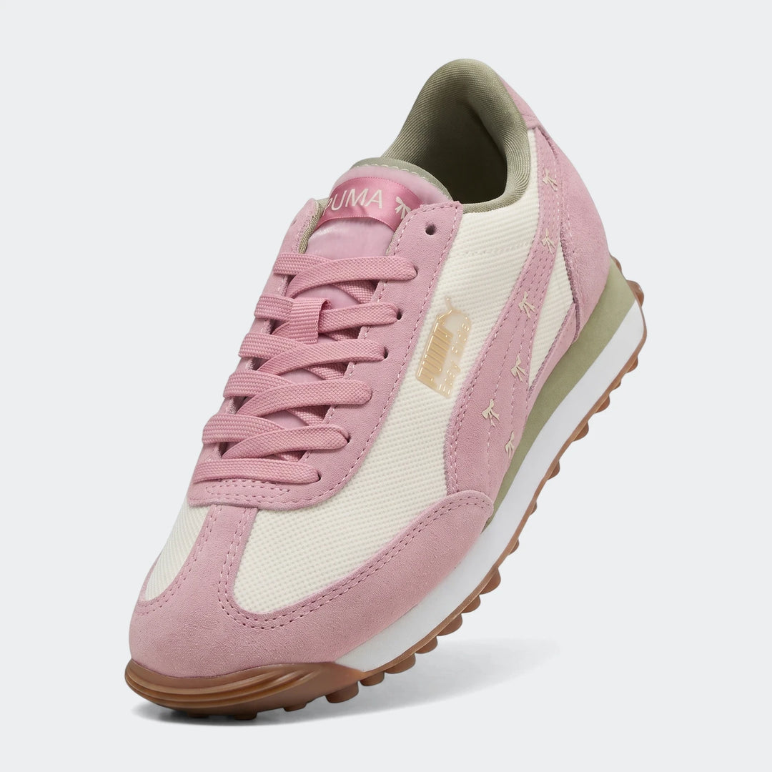 Pink and off-white Puma Easy Rider Bowtique Ps sneakers with suede and mesh details, featuring pink laces and a brown rubber