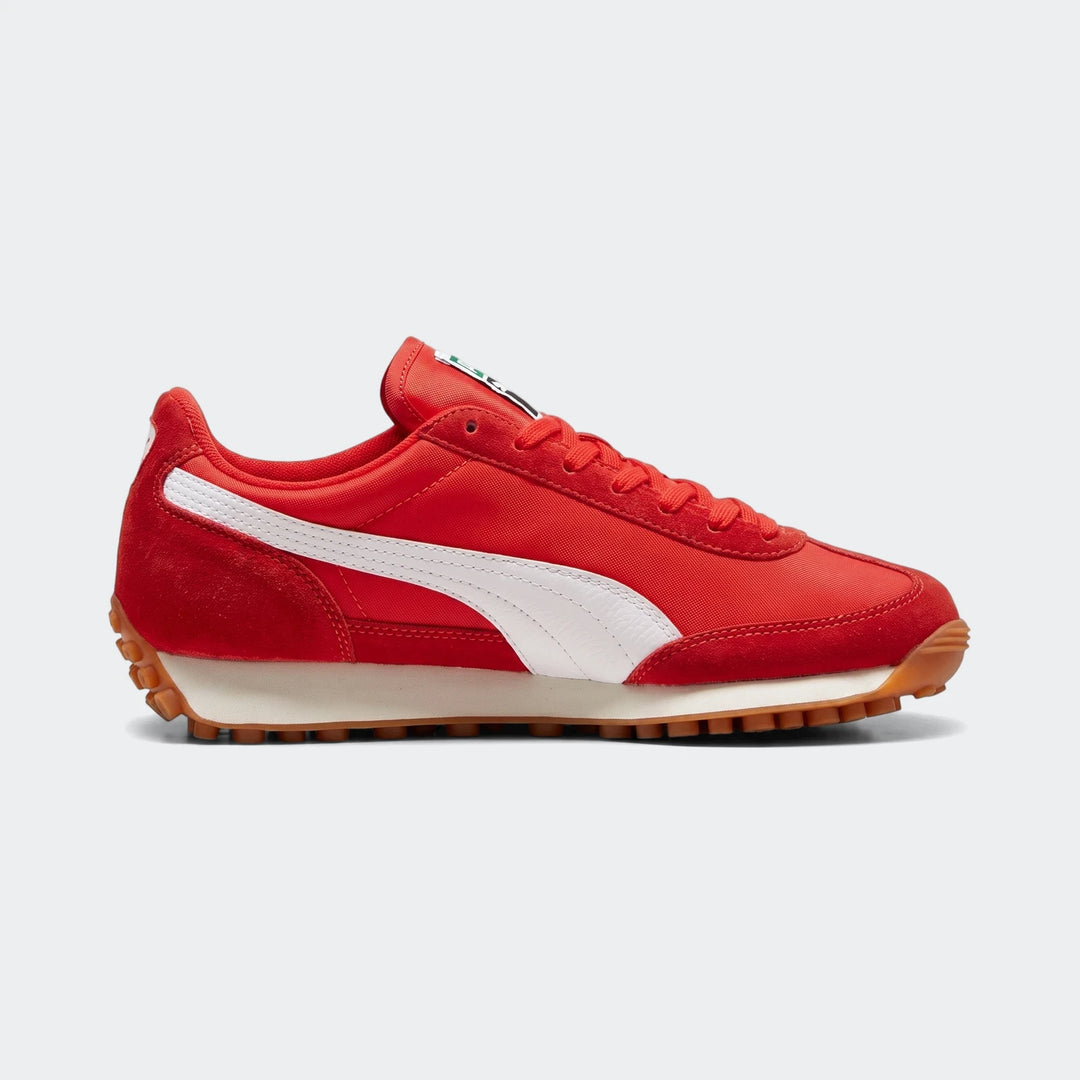 Red and white Puma Easy Rider Vintage PS sneakers, side view, showcasing suede and nylon upper with classic Formstrip design.