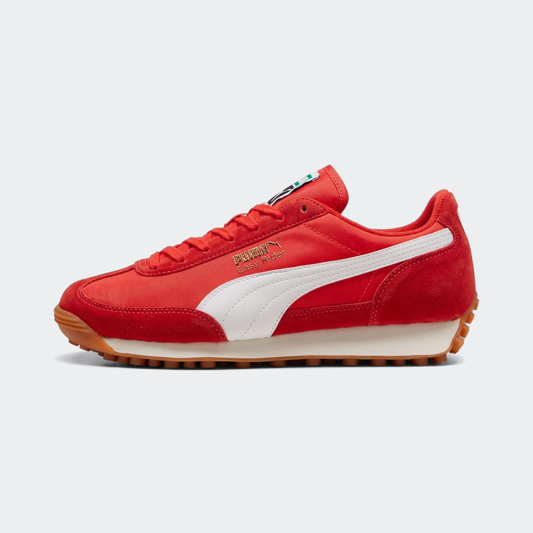 Red Puma Easy Rider Vintage PS sneakers, featuring a white formstrip, brown gum sole, and cream midsole, viewed from the