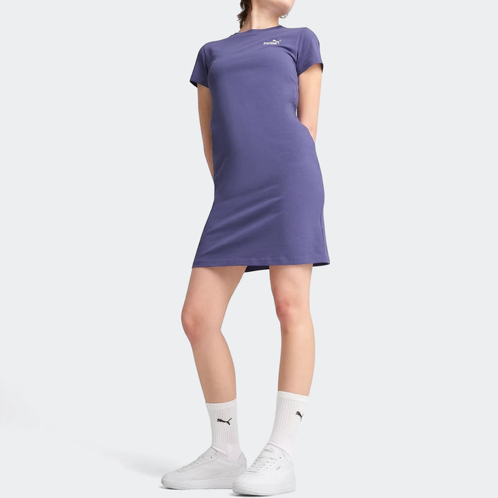 Women's purple Puma Ess+ Logo short-sleeve mini dress. Full body view of the casual dress on a model.