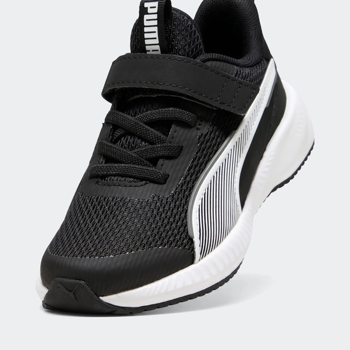 Single black and white Puma Flyer 3 Kids' Running Shoe, made with breathable mesh, shown angled on a white surface.
