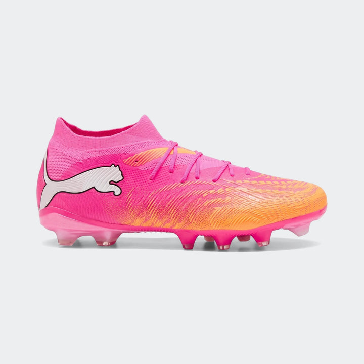 Unisex Puma Future 9 Match Fg/Ag football boots in vibrant pink and orange with a white logo, shown from the side.