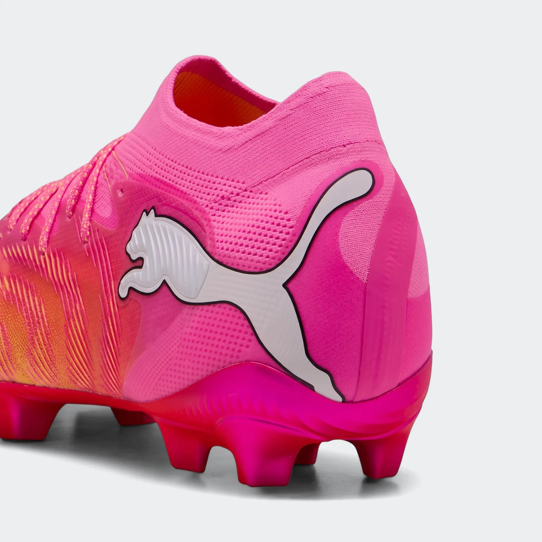 Close-up of the heel and midfoot of a vibrant pink and orange Puma Future 9 Ultimate Fg Football Boot with a white logo.