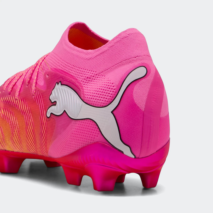 Close-up of the heel and midfoot of a vibrant pink and orange Puma Future 9 Ultimate Fg Football Boot with a white logo.