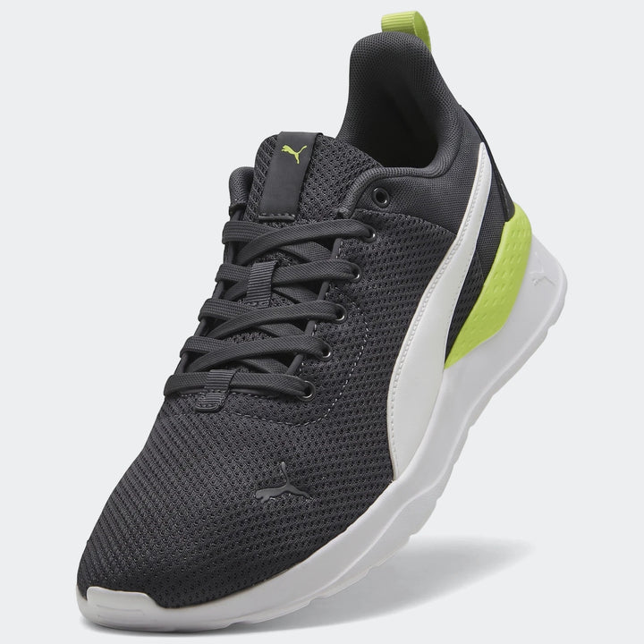 Puma Mens Anzarun Lite sneakers in dark gray mesh with white soles and neon yellow accents, shown at an angle.