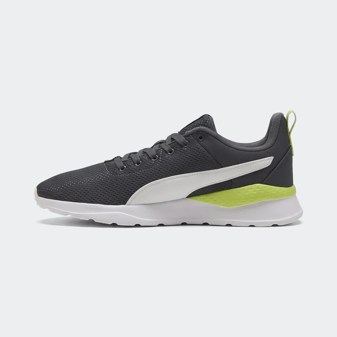 Puma Mens Anzarun Lite Sneakers in dark gray with white Formstrip and neon yellow accents, shown in a side view.