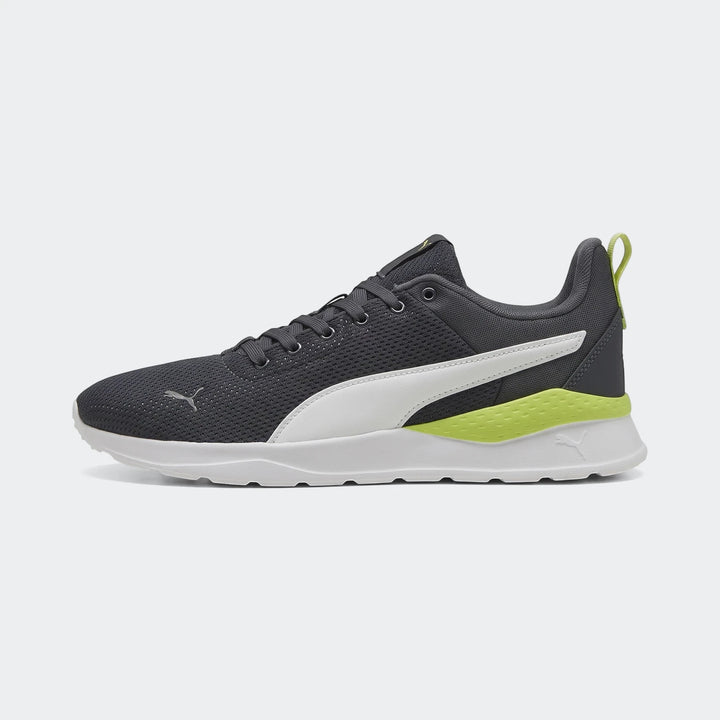 Puma Mens Anzarun Lite Sneakers in dark gray with white accents and neon yellow detailing, shown from a side profile.