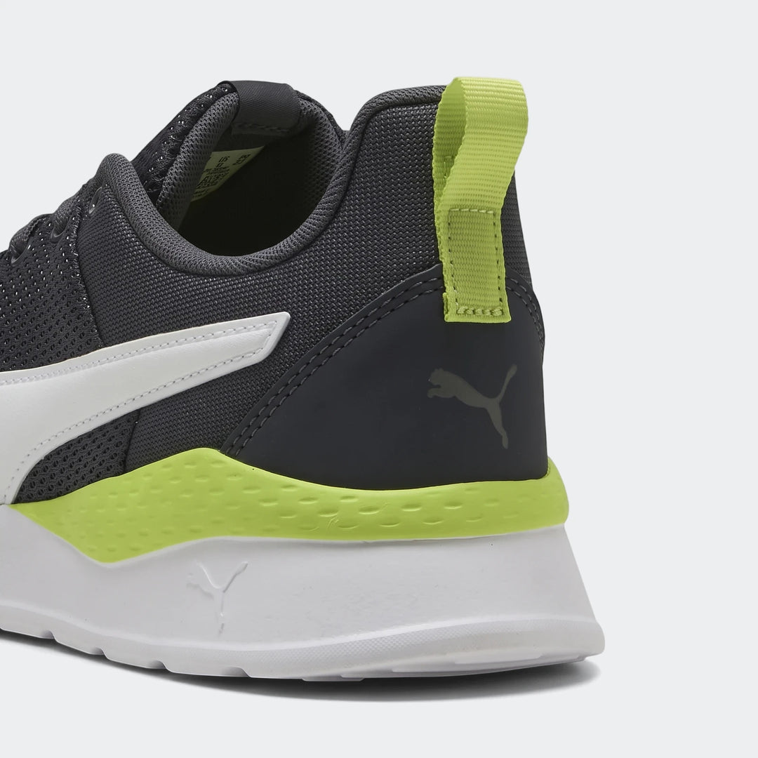 Close-up rear view of Puma Men's Anzarun Lite sneakers in dark grey, white, and lime green, featuring a mesh upper and heel