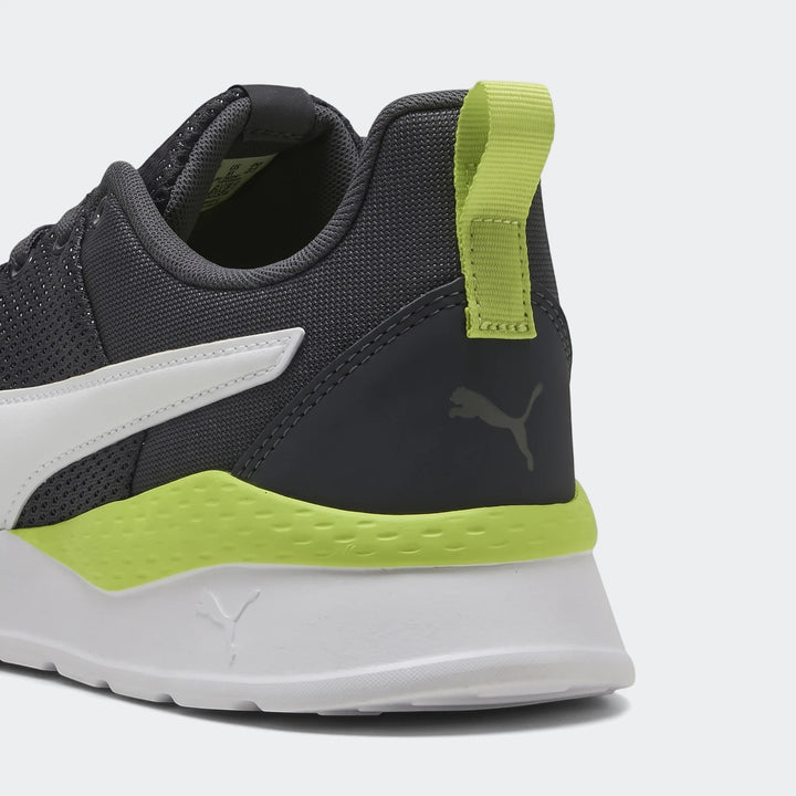 Close-up rear view of Puma Men's Anzarun Lite sneakers in dark grey, white, and lime green, featuring a mesh upper and heel