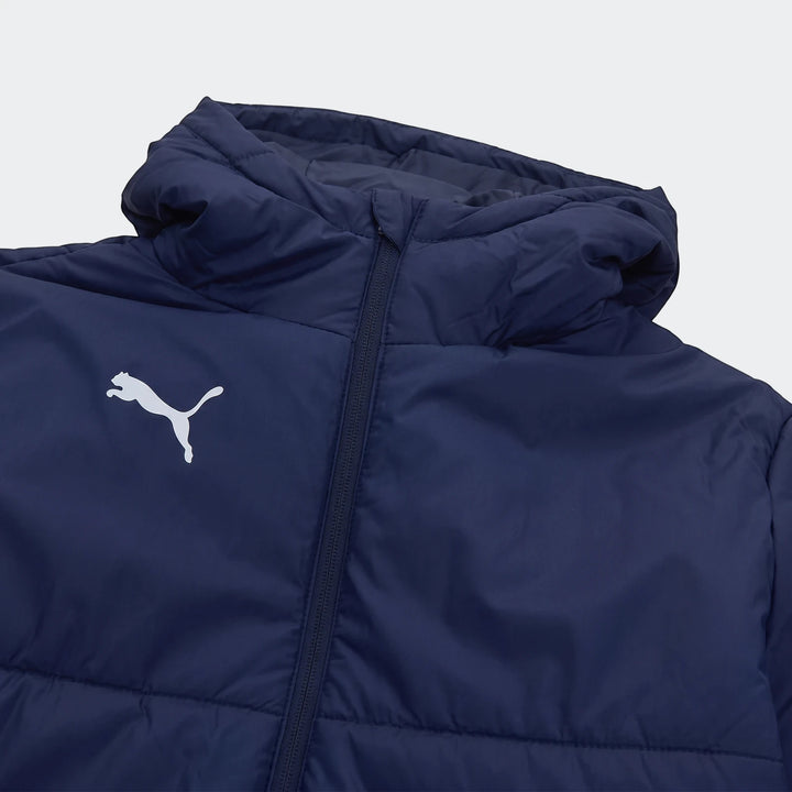 Close-up of a dark blue Puma Mens Bench Jacket with a quilted design, white Puma logo on the chest, and central zipper